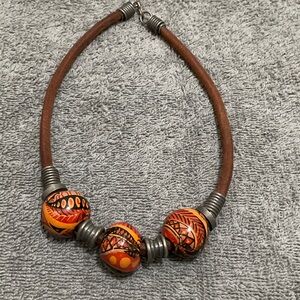 Handcrafted Orange Bead Leather Necklace with Tribal Motif